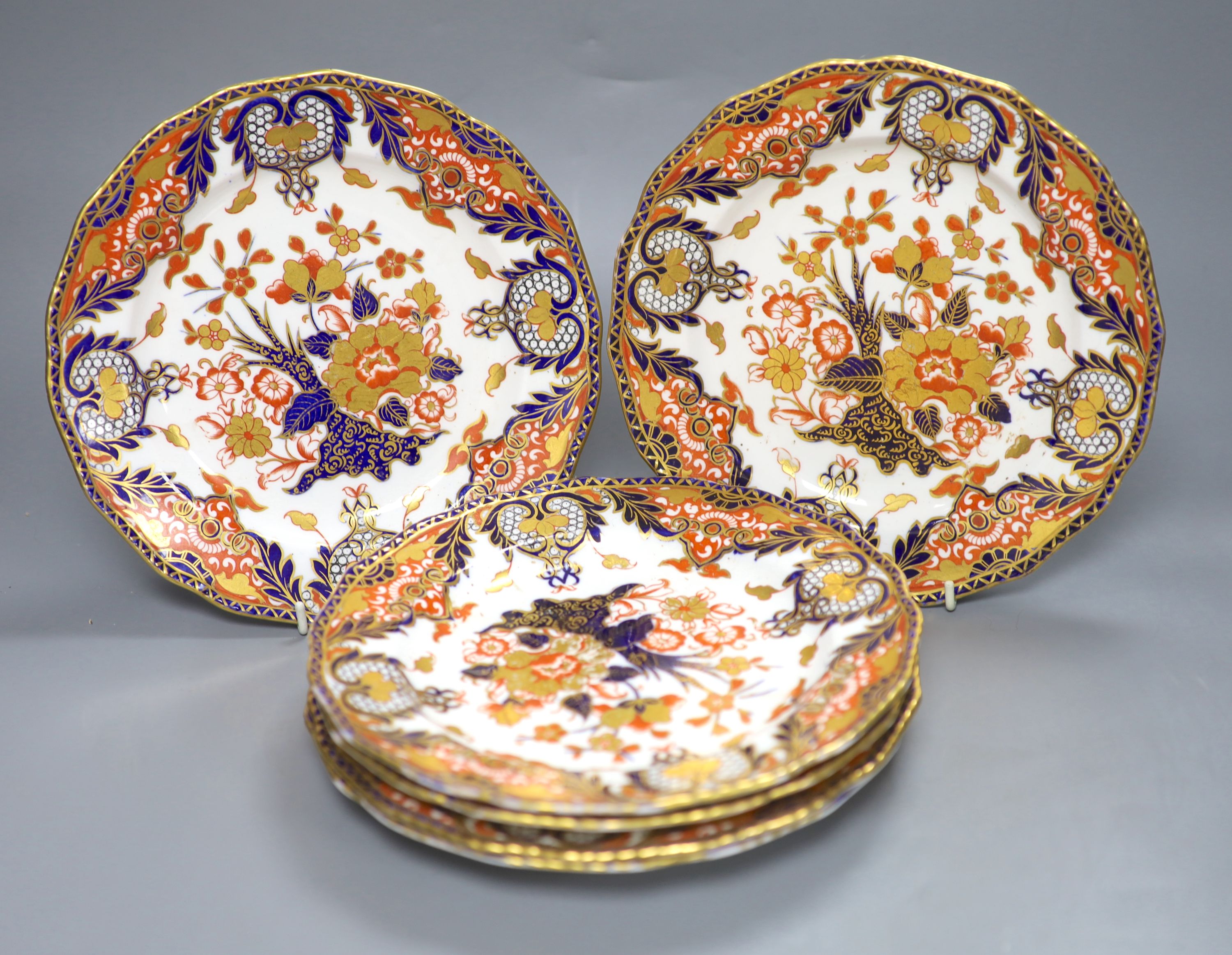 A set of six Royal Crown Derby dessert dishes, decorated in an Imari palette, diameter 23cm